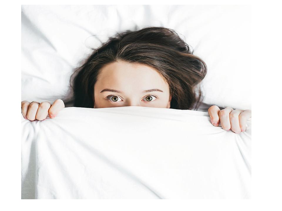 woman in bed fighting illnesses