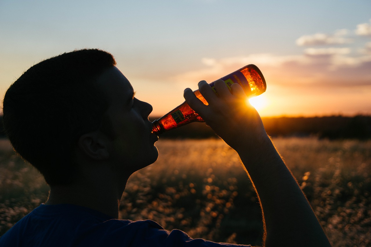 man drinking a beer