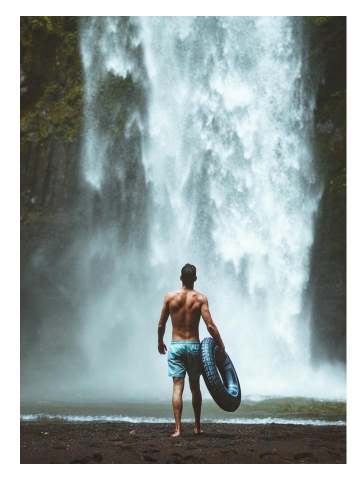 man in a waterfall