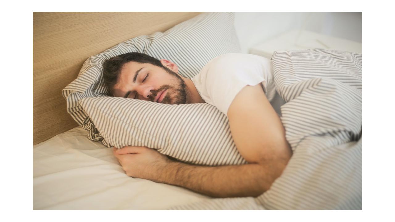 man with sleep disorders trying to sleep